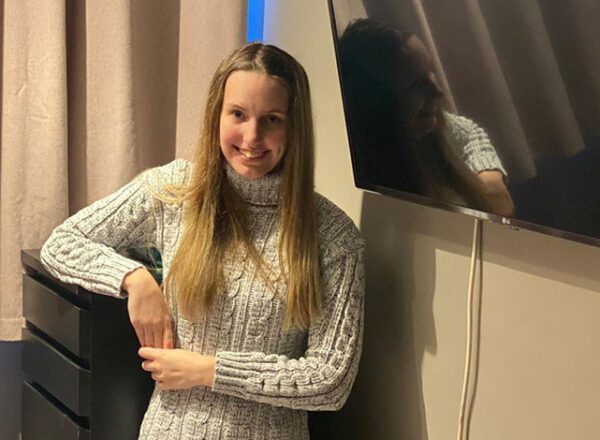 Girl standing in bedroom