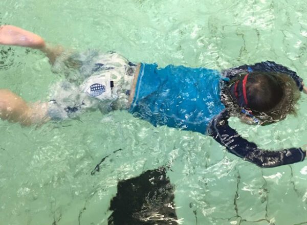 Young child having swimming lessons with Level Water