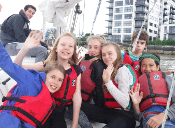 Young disadvantaged children sailing